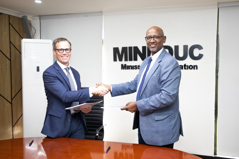 Minister of Education Joseph Nsengimana and John Endrud, WorldQuant University CEO at the signing ceremony in Kigali on Tuesday, September 9. Courtesy