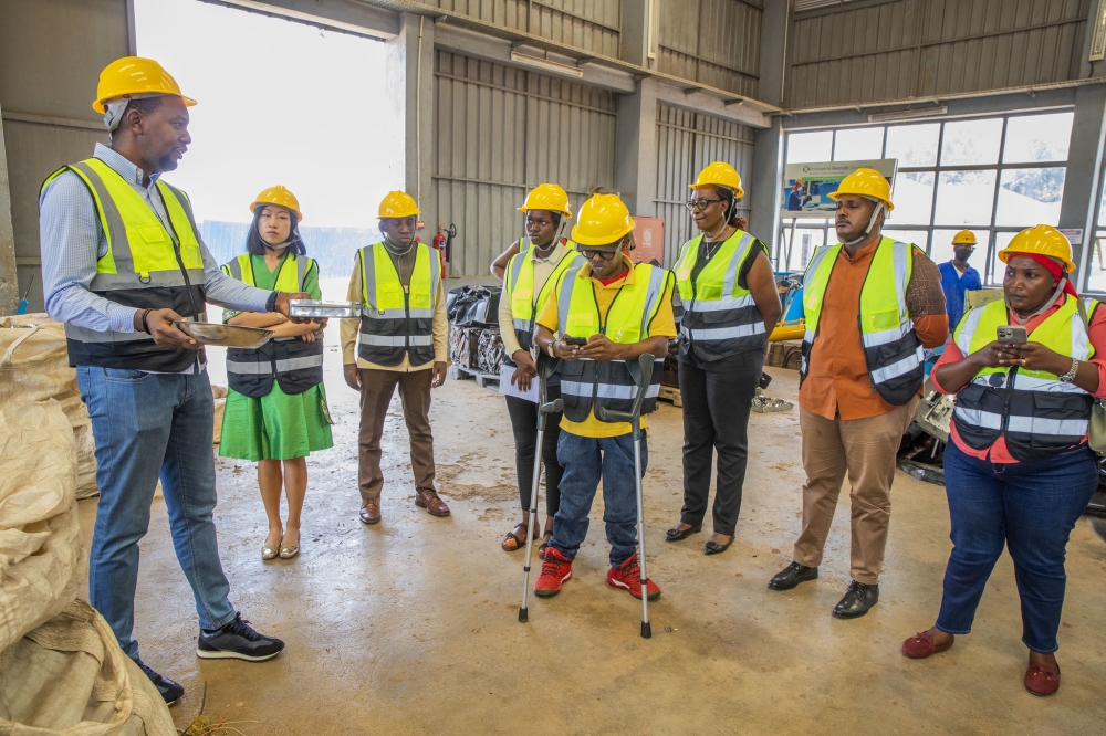 RDB staff and journalists during a guided tour of  Enviroserve Rwanda, an e-waste recycling company in Bugesera District. All photos by Craish Bahizi