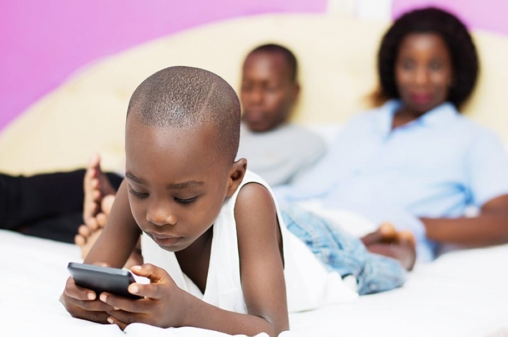 A child watches a video on a smartphone at home. Research has revealed that smartphone use among children under 13 could negatively impact their mental health. Courtesy