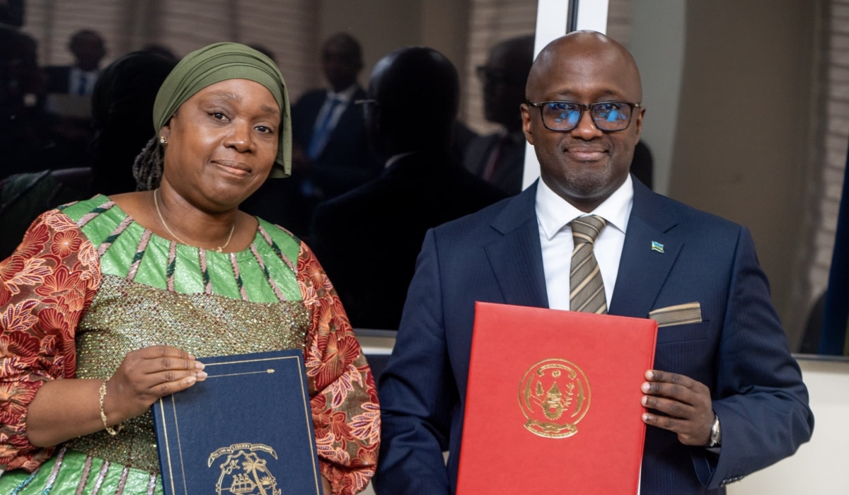 Minister of Foreign Affairs Olivier Nduhungirehe and his Liberian counterpart  Sara Beysolow Nyanti  during the signing event on Wednesday, September 10. Courtesy