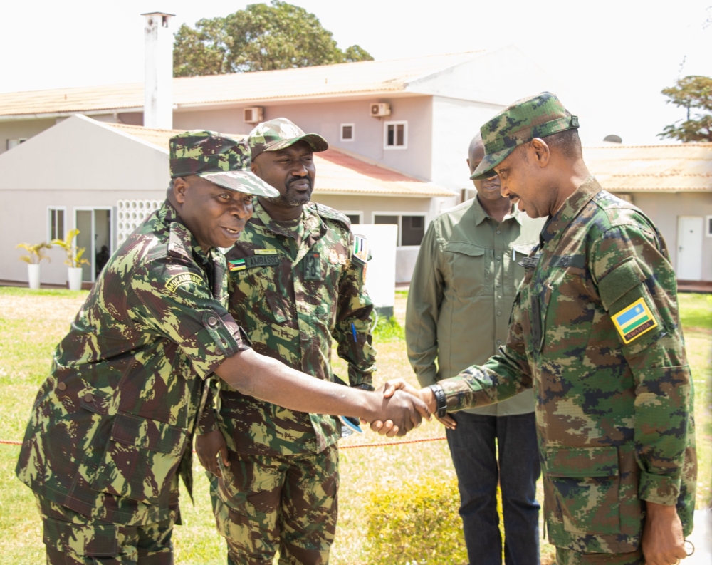 General Ruvusha (right) shakes hands with his Mozambican counterpart Mahunguane during the joint operational meeting on Friday. Photo by RDF media.