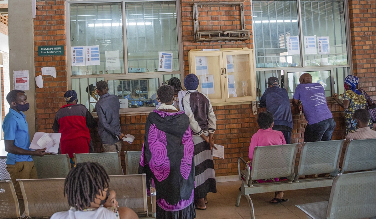 Patients and their guardians pay for services at Masaka Hospital in Kicukiro. Photo by Craish Bahizi