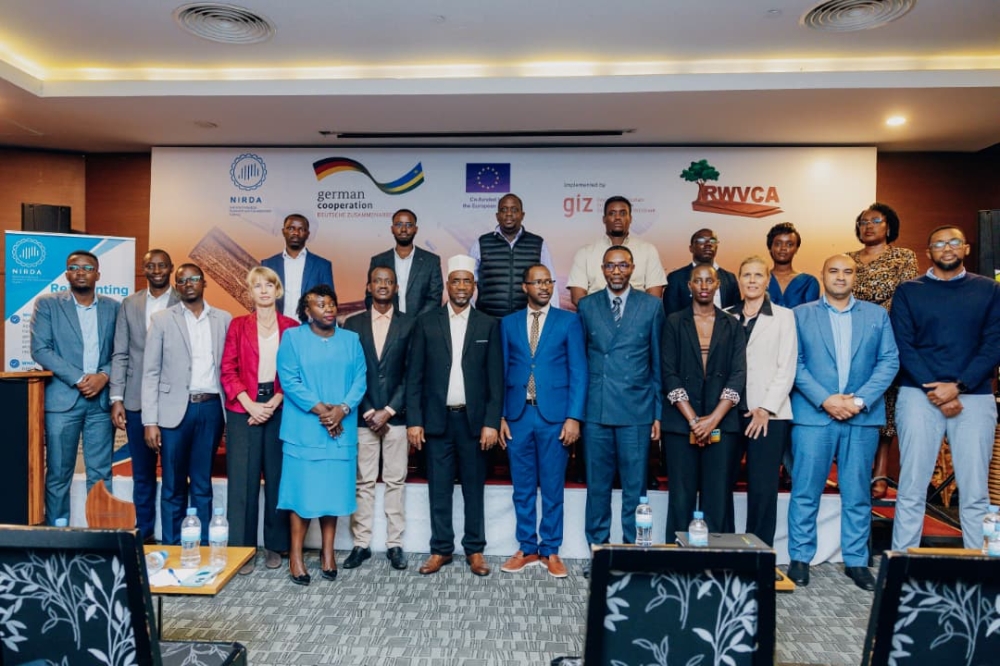 Officials and participants pose for a photo at the inaugural Rwanda Wood Sector Forum (RWSF) on September 17. Photos by Craish BAHIZI