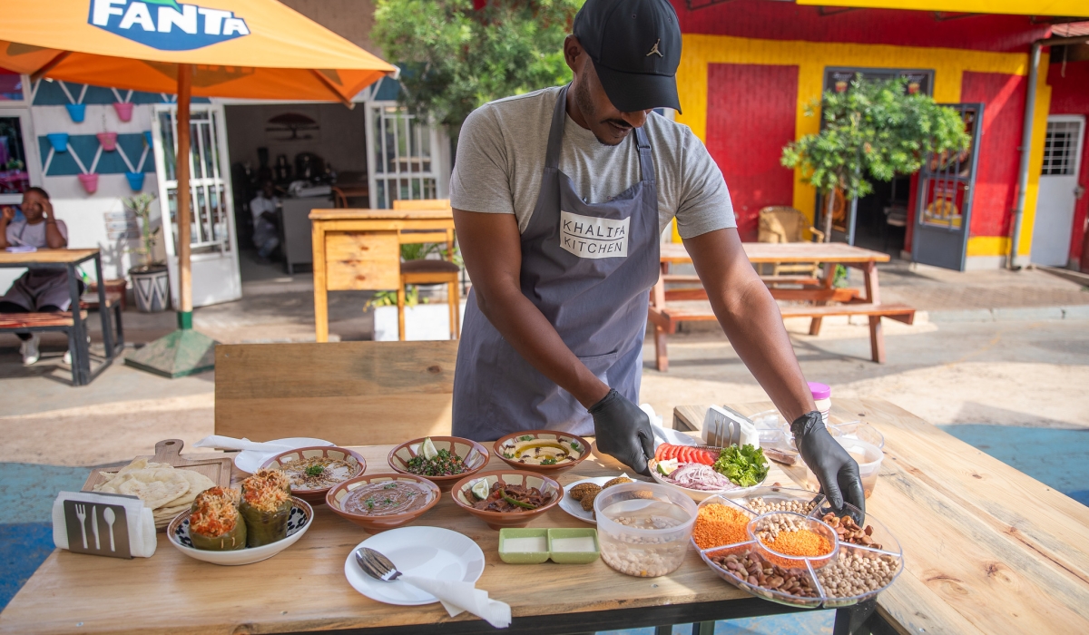A cook prepares food for his clients at Biryogo Car Free Zone in Kigali. RDB has announced extended operating hours for hospitality businesses, particularly shopping centers, restaurants, bars, and nightclubs. Willy M