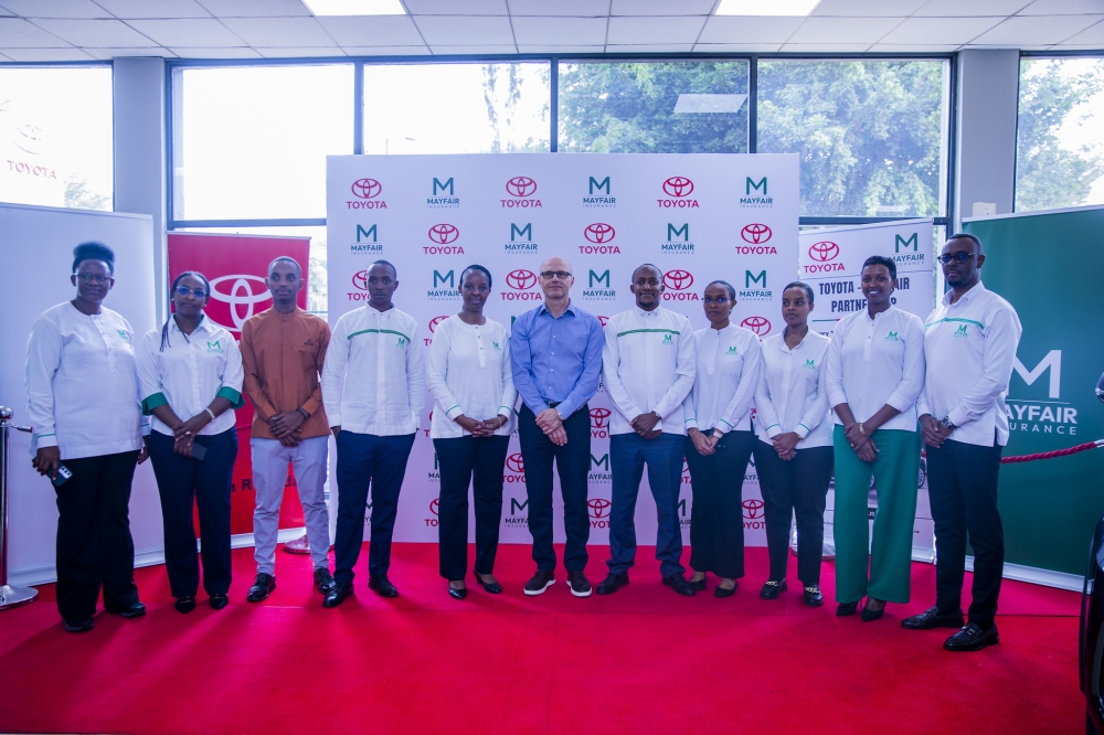 Toyota and Mayfair Insurance Rwanda officials pose for a photo during the signing ceremony in Kigali on September 17.