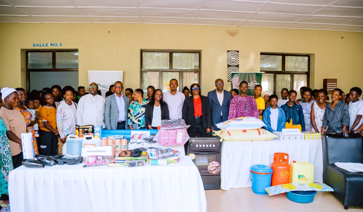 BRALIRWA Plc and Empower Rwanda officials pose for a group photo with the beneficiary during the launch on Thursday, September 18. Photos by Craish Bahizi