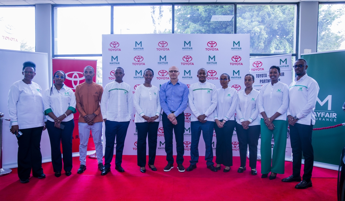 Toyota and Mayfair Insurance Rwanda officials pose for a photo during the signing ceremony in Kigali on September 17.