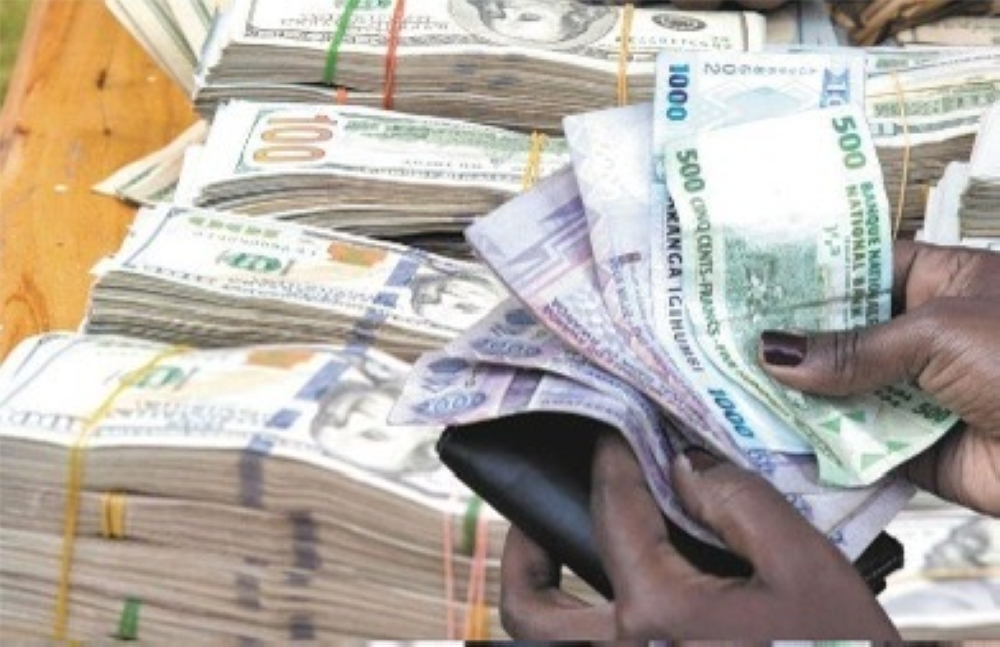 Stacks of US dollar bills on a table. While the Rwandan Franc is the only legal tender in Rwanda, there are people or entities allowed to get payments in foreign currencies in the country, depending on the nature of their businesses (Internet photo)