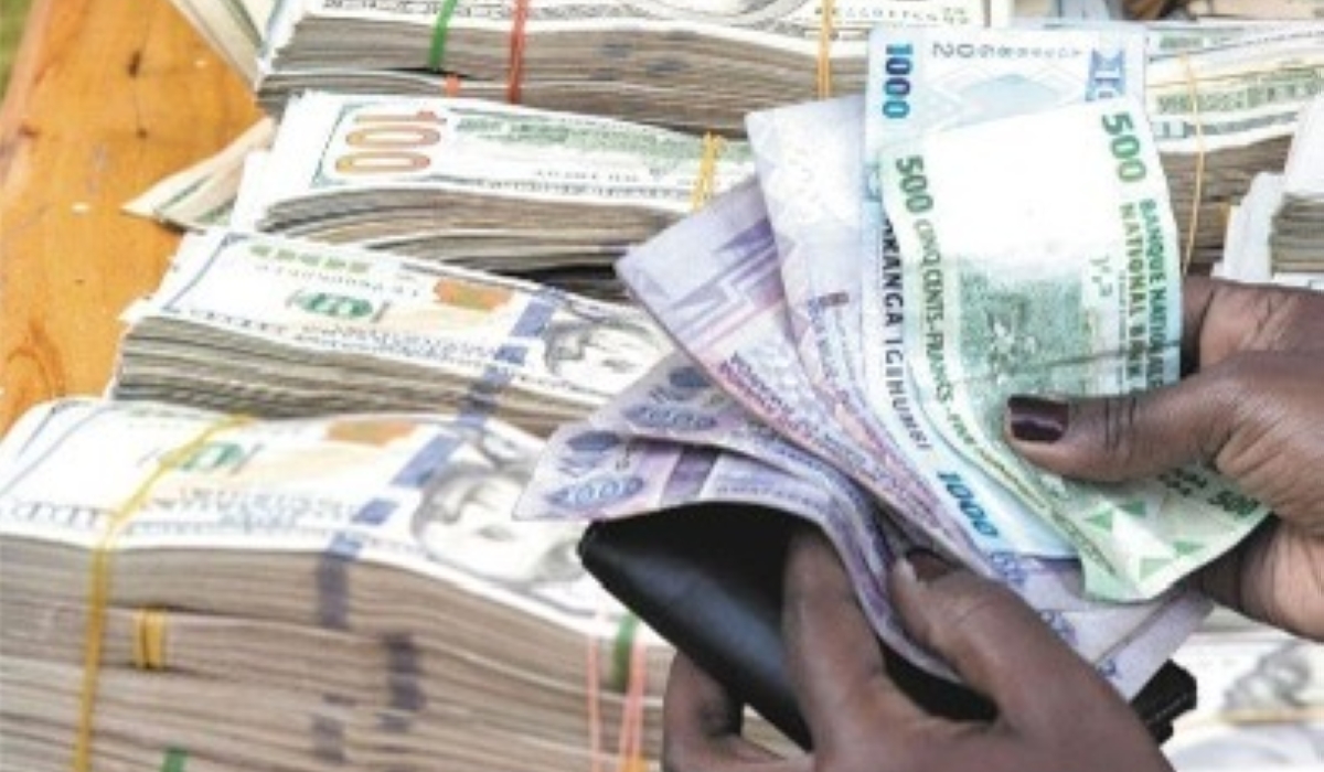 Stacks of US dollar bills on a table. While the Rwandan Franc is the only legal tender in Rwanda, there are people or entities allowed to get payments in foreign currencies in the country, depending on the nature of their businesses (Internet photo)