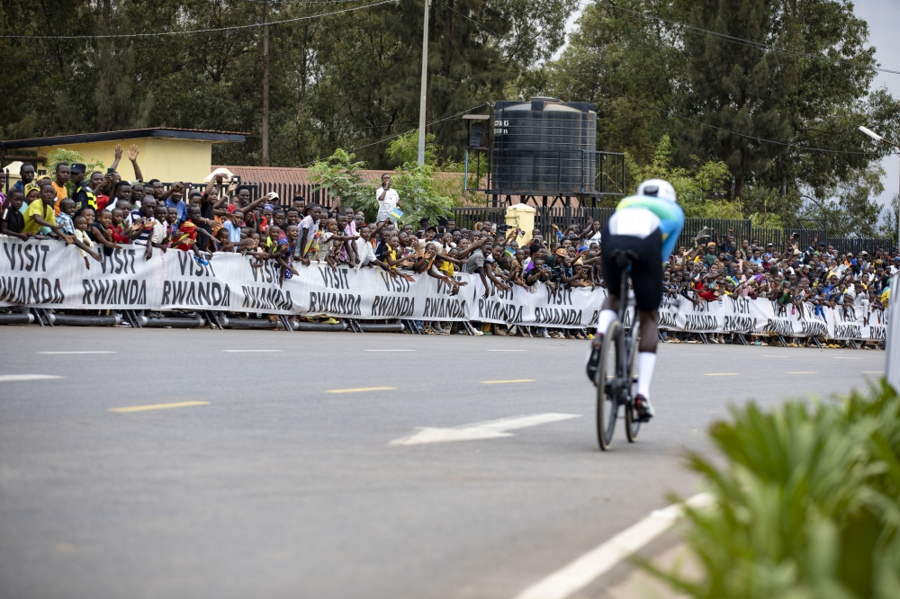 Rwandans cheer on Etienne Tuyizere at Kicukiro-Nyanza. The race is proving to be more than just a competition, it is also celebration and a spectacle of entertainment. 