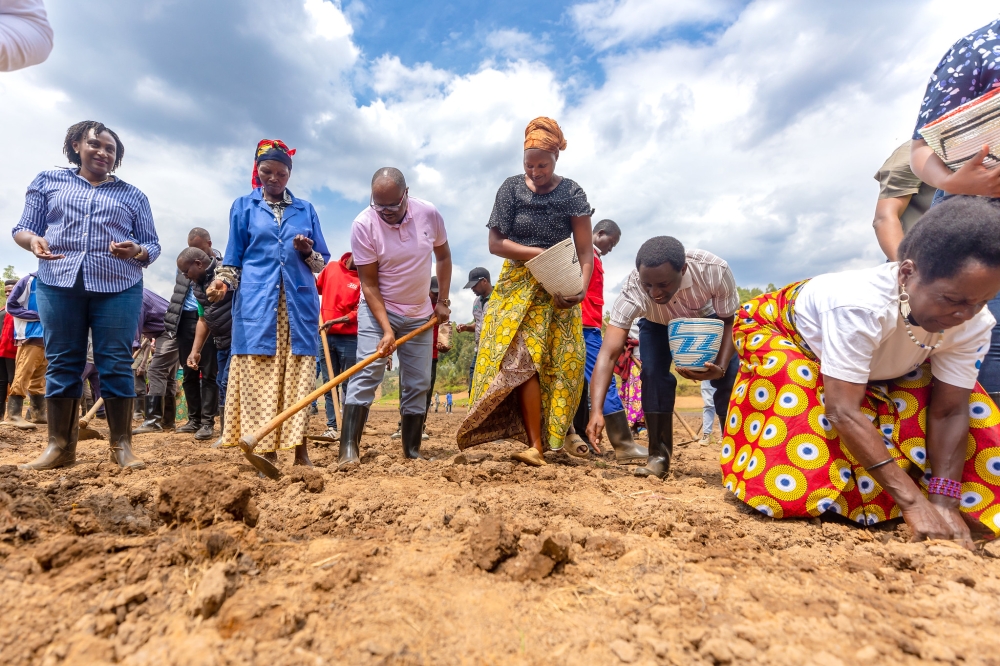 Prime Minister Justin Nsengiyumva joins farmers during the launch of the 2026 Agriculture season A in Nyaruguru District on Monday, September 22.  PHOTOS BY CRAISH BAHIZI