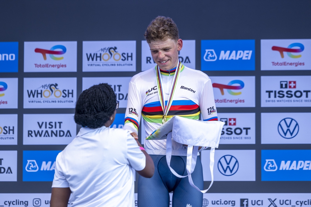 Bank of Kigali CEO Dr Diane Karusisi awards the winner of the men&#039;s Junior Individual Time Trial U23 on Tuesday, September 23. Photo Olivier Mugwiza