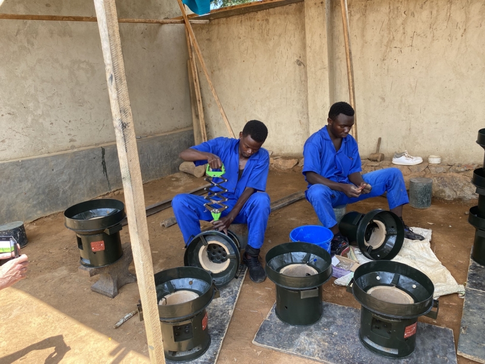 Technicians assemble improved cookstoves in Kigali. EAQIP-supported enterprises are creating new jobs and building local skills in clean energy technologies.
