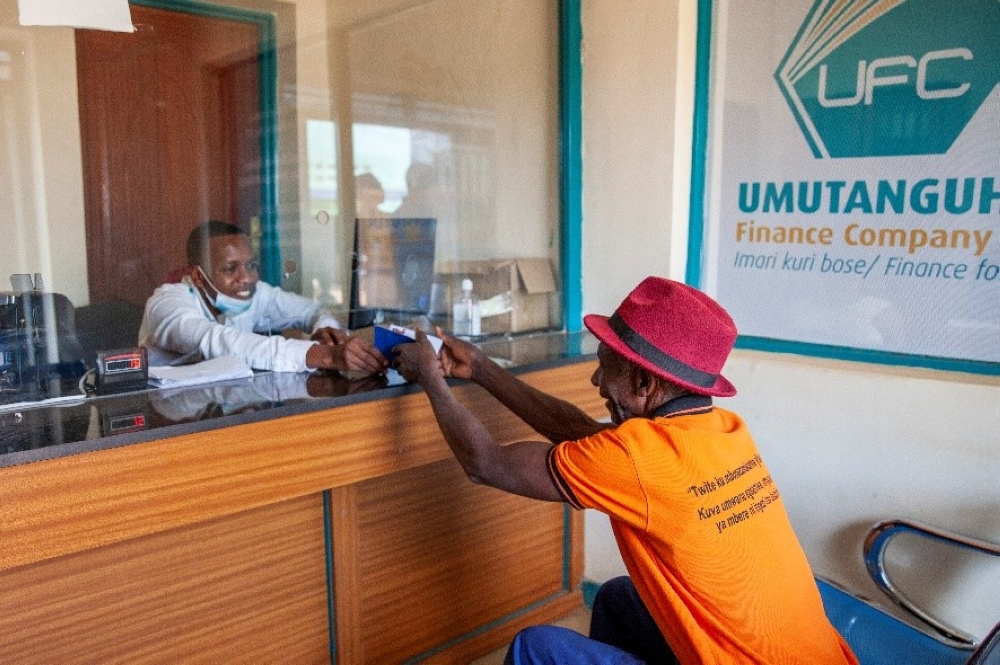 A resident in Kirehe accesses financial services at the Umutanguha Finance Company branch, established with support from AFR. A resident in Kirehe accesses financial services at the Umutanguha Finance Company branch, established with support from AFR.