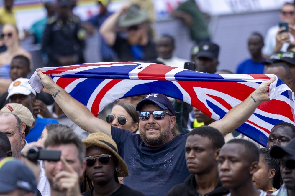 Team England fans wave their national flag in support of their riders.