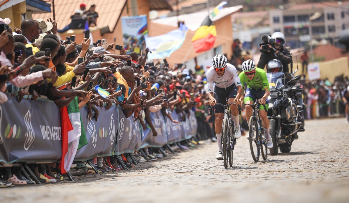 Isaac del Toro Romero (Mexico) and Slovenia’s Tadej Pogačar climb the cobbled street of Mur de Kigali in Nyarugenge on Sunday. Photo by Olivier Mugwiza