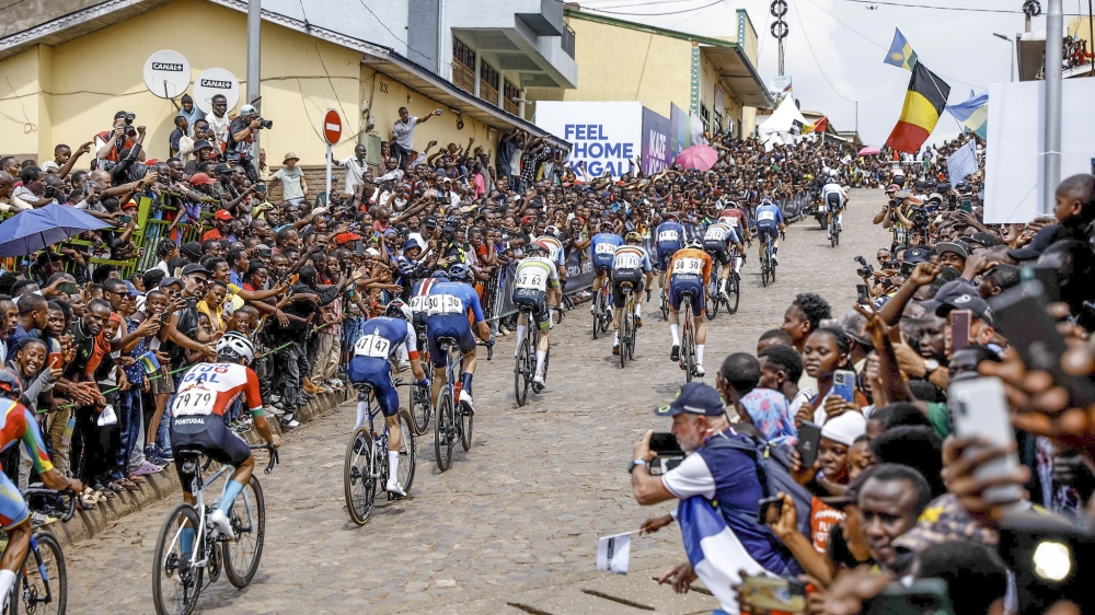 Thousands of cycling enthusiasts cheer on riders while climbing Mur de Kigali on Sunday, September 28. Photos by Dan Gatsinzi