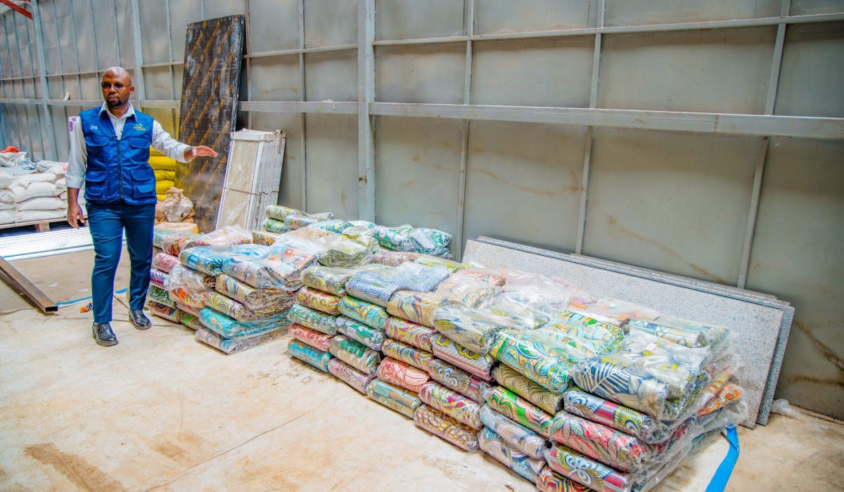 Jean-Paulin Uwitonze, the Assistant Commissioner in charge of Taxpayer Services and Communications at RRA, while presenting the smuggled fabrics of Kitenge intercepted in Rusizi District on September 28.