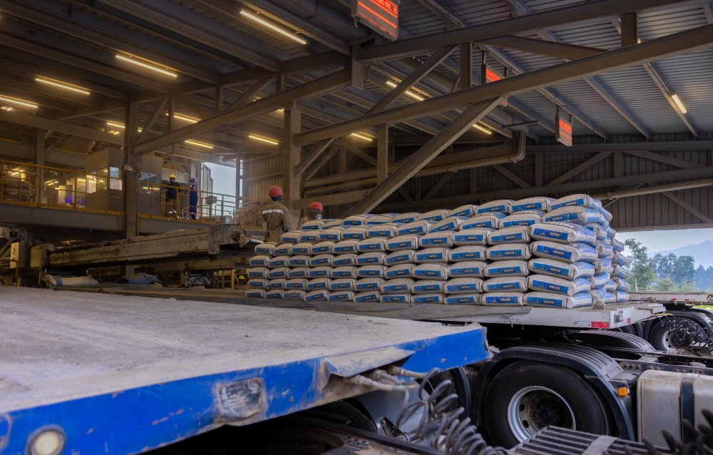 Cimerwa factory workers pack cement for market. The firm plans a $190m clinker plant to cut imports and save Rwanda an estimated $2.88bn in foreign exchange over 25 years. File