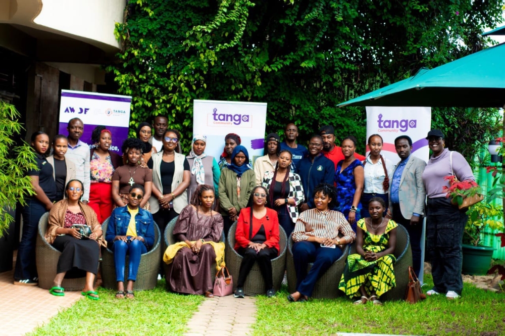Participants pose for a group at the workshop to present the results of the survey