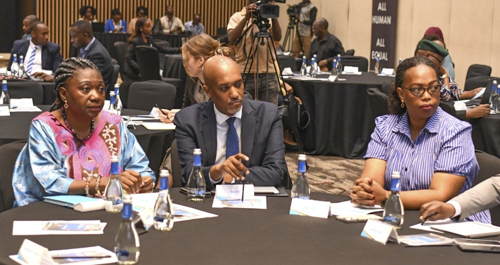 Minister of Justice Emmanuel Ugirashebuja and delegates follow a presentation at the National Stakeholders’ Validation Workshop, held on Tuesday, September 30. courtesy