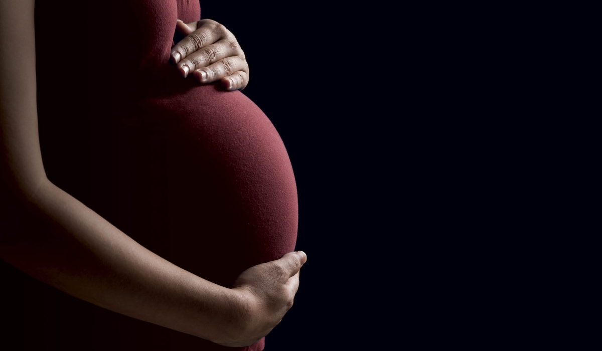Pregnant woman’s hands resting on her belly. The government plans to introduce early prenatal DNA testing to aid justice in defilement cases. Internet Photo