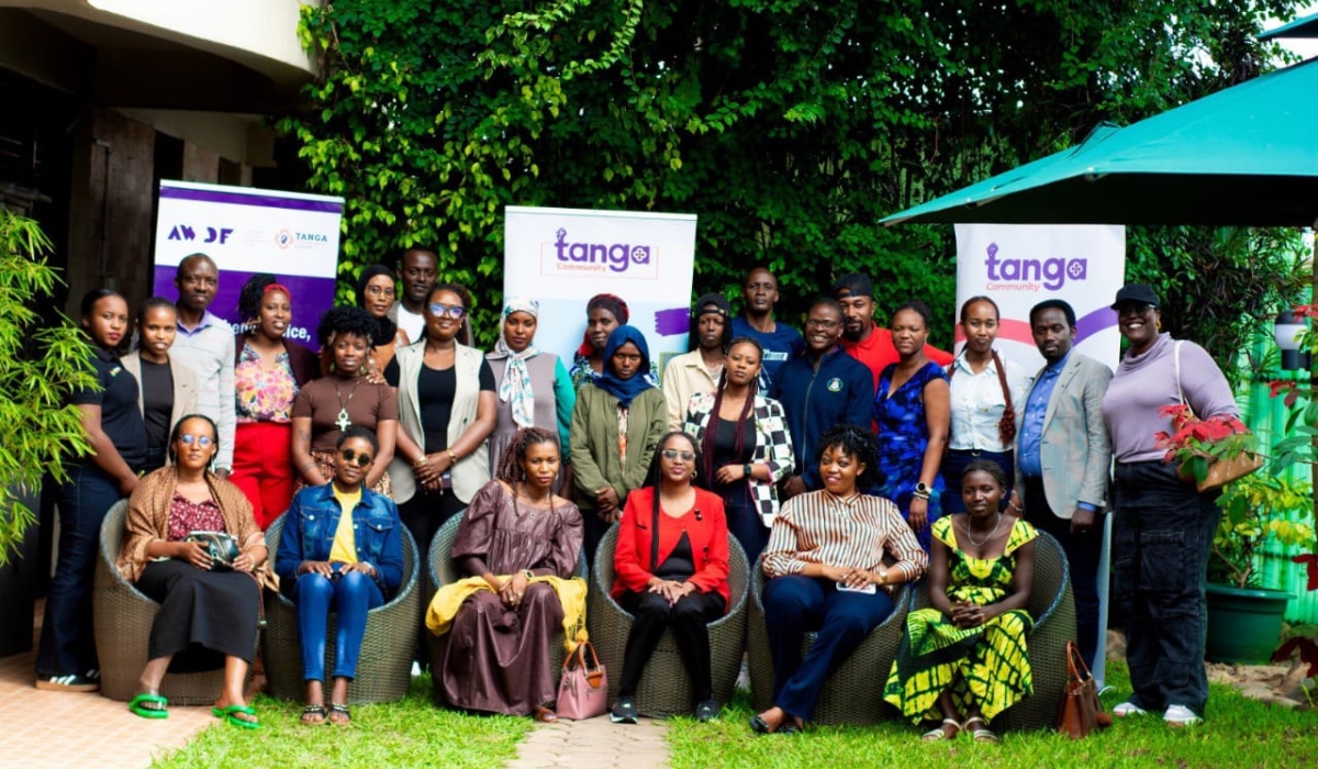 Participants pose for a group at the workshop to present the results of the survey
