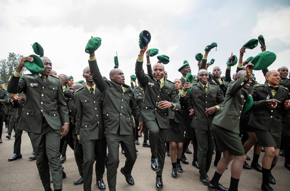 RDF new officers during a morale boosting session at the passing-out ceremony of the 12th intake of Officer Basic Training, at Rwanda Military Academy in Gako. Dan Gatsinzi