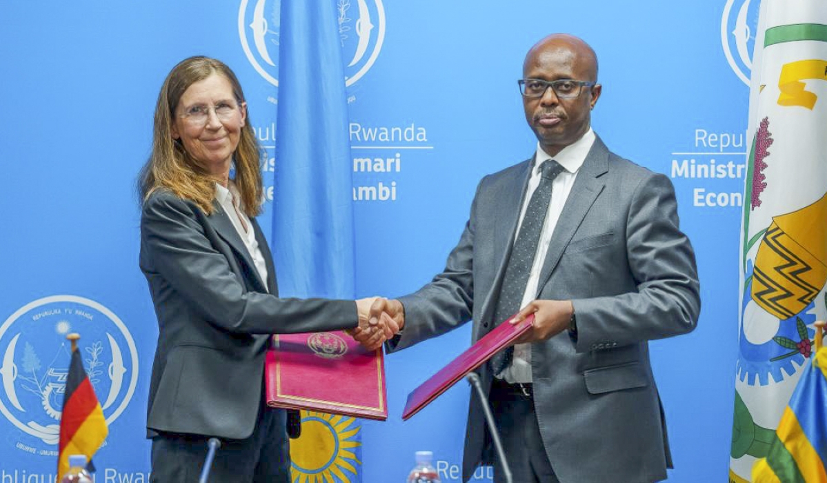  Yusuf Murangwa, Minister of Finance and Economic Planning, and Heike Uta Dettmann, the German Ambassador to Rwanda exchange documents during the signing ceremony in Kigali on Monday, October 6. Courtesy