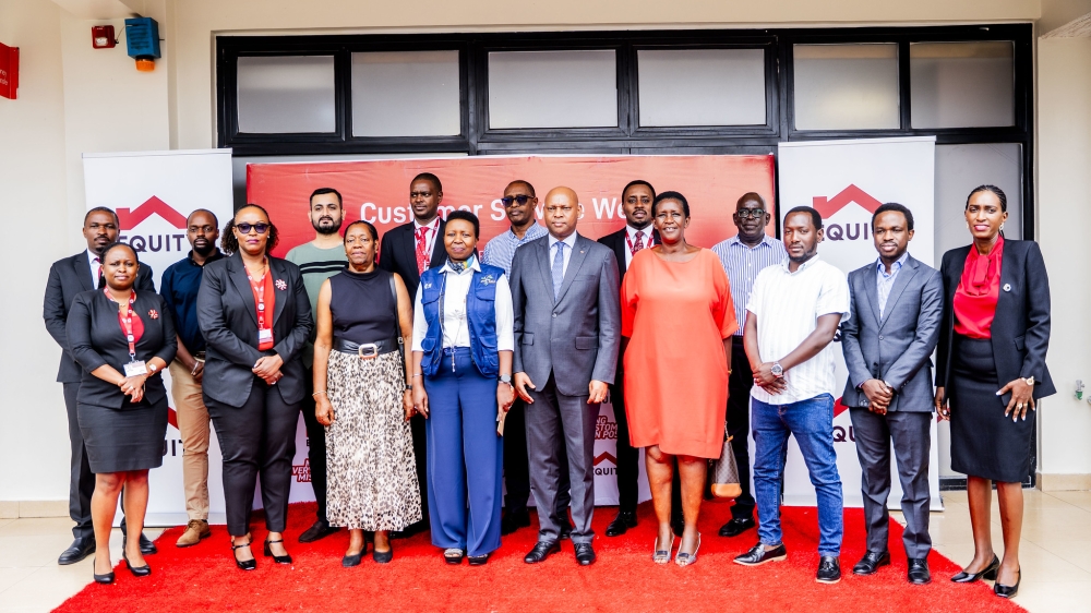 Bank officials and customers pose for a group photo at the launch of Customer Service Week.