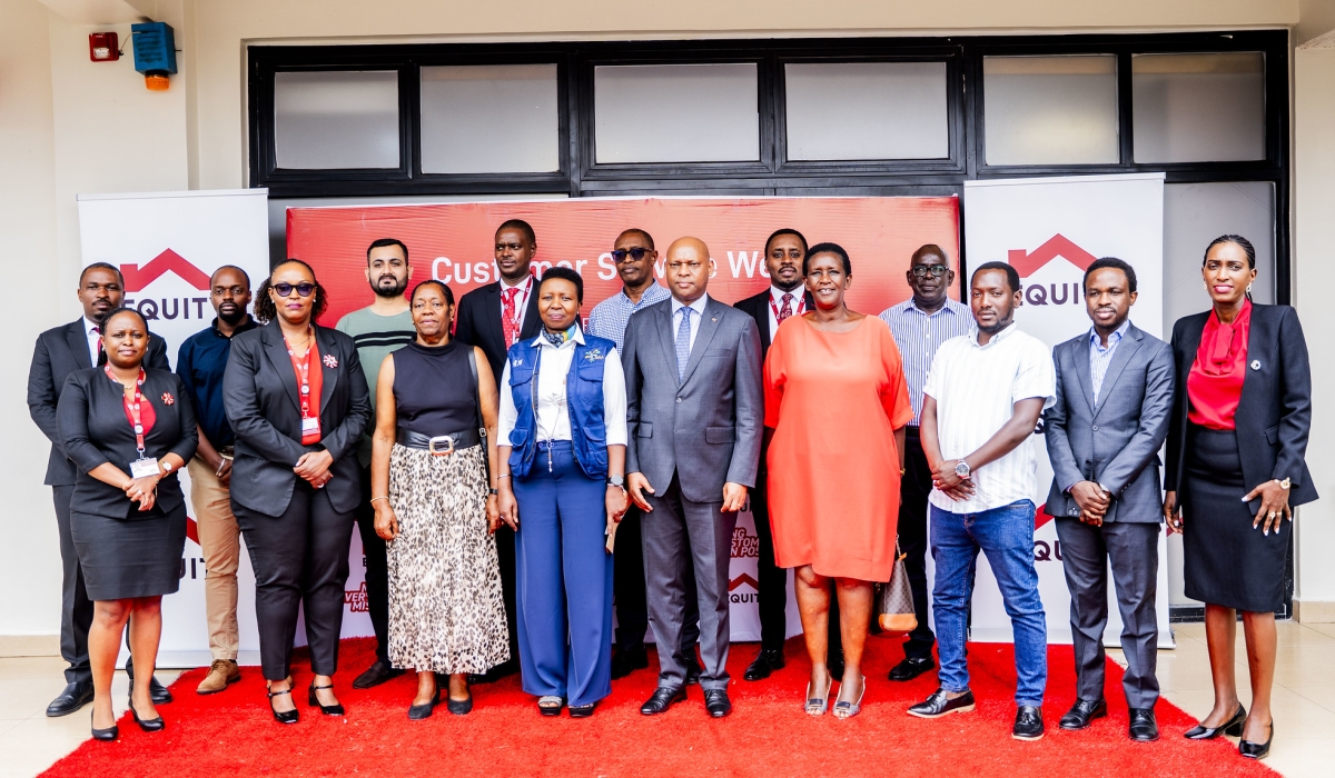 Bank officials and customers pose for a group photo at the launch of Customer Service Week.