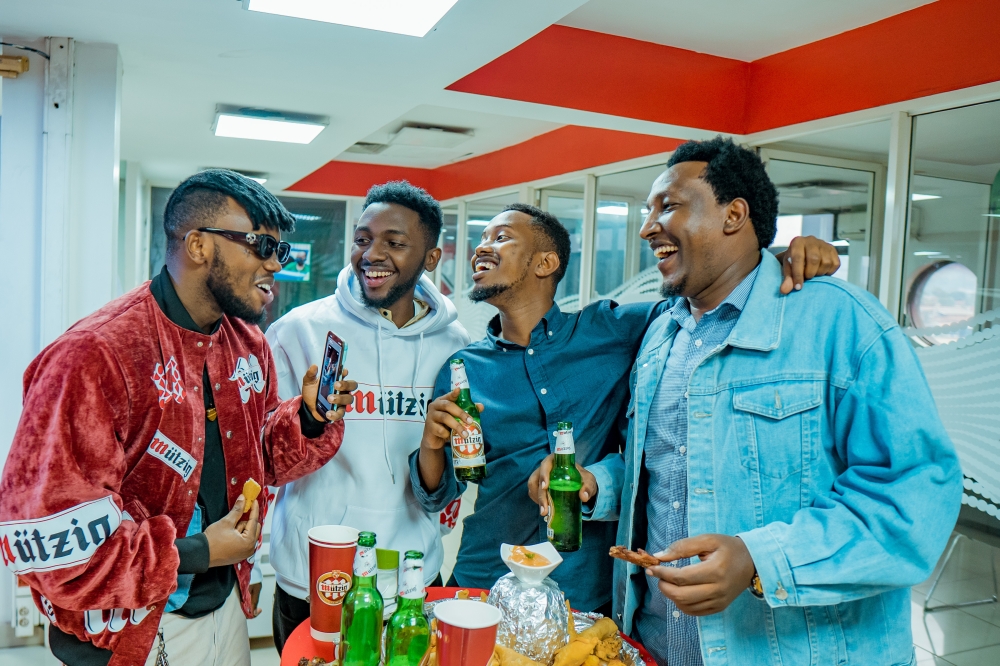 Chriss Eazy, the newly announced brand ambassador, chats with other participants at the launch.