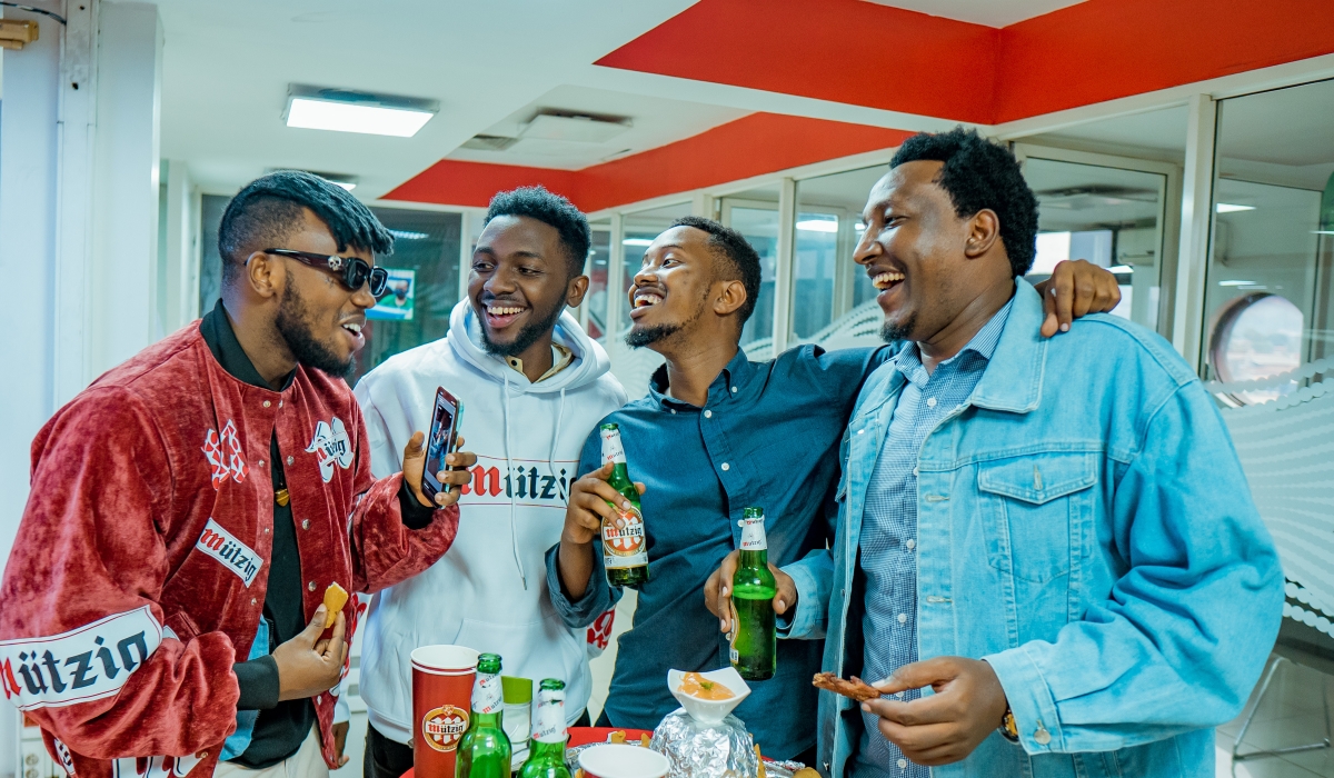 Chriss Eazy, the newly announced brand ambassador, chats with other participants at the launch.