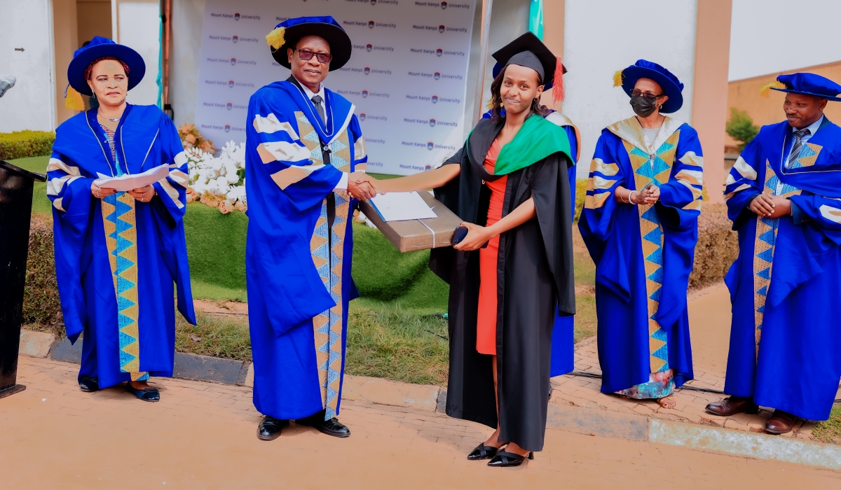 Prof Kabaji awards the best performer, Uwase Karangwa Novella, from the School of Journalism and Mass Communication, during the Mount Kenya University&#039;s 27th graduation ceremony held on 8th August, 2025, in Kigali.