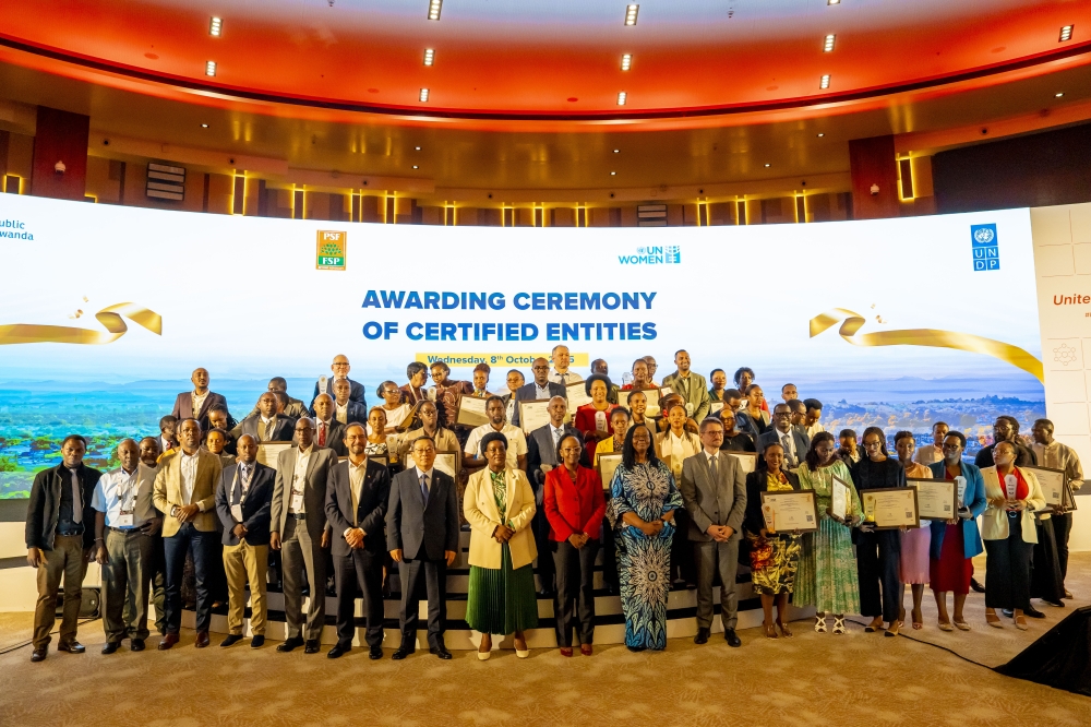 Representatives of the pioneering entities pose for a group photo with senior officials at the event on Wednesday, October 8. All photos by Craish Bahizi