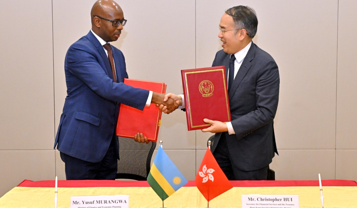 Yusuf Murangwa, Rwanda’s Minister of Finance and Economic Planning, and Christopher Hui, Secretary for Financial Services and the Treasury of Hong Kong sign the deal on Thursday, October 9. Courtesy 