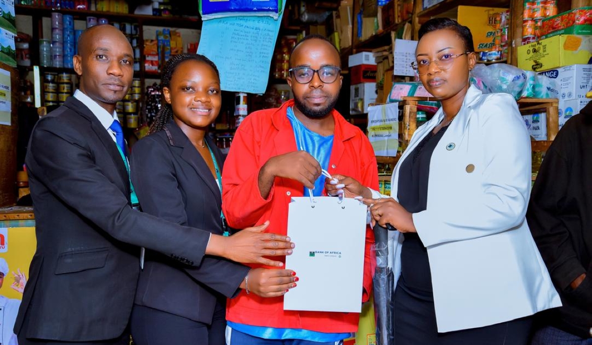 Bank staff and customers pose for a photo at the launch of Customer Service Week.