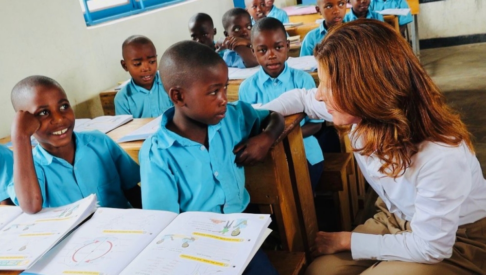 P3 students at G.S. Kirebe in Gakenke District interact with Minister Jennifer Chapman on Thursday, October 9. Courtesy