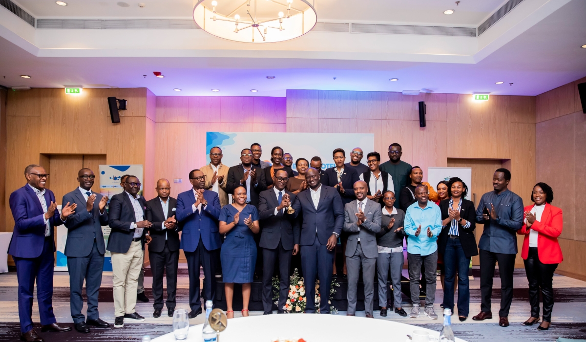 Officials pose for a group photo during the listing ceremony of Energicotel PLC in Kigali on October 10. Photos by Craish Bahizi