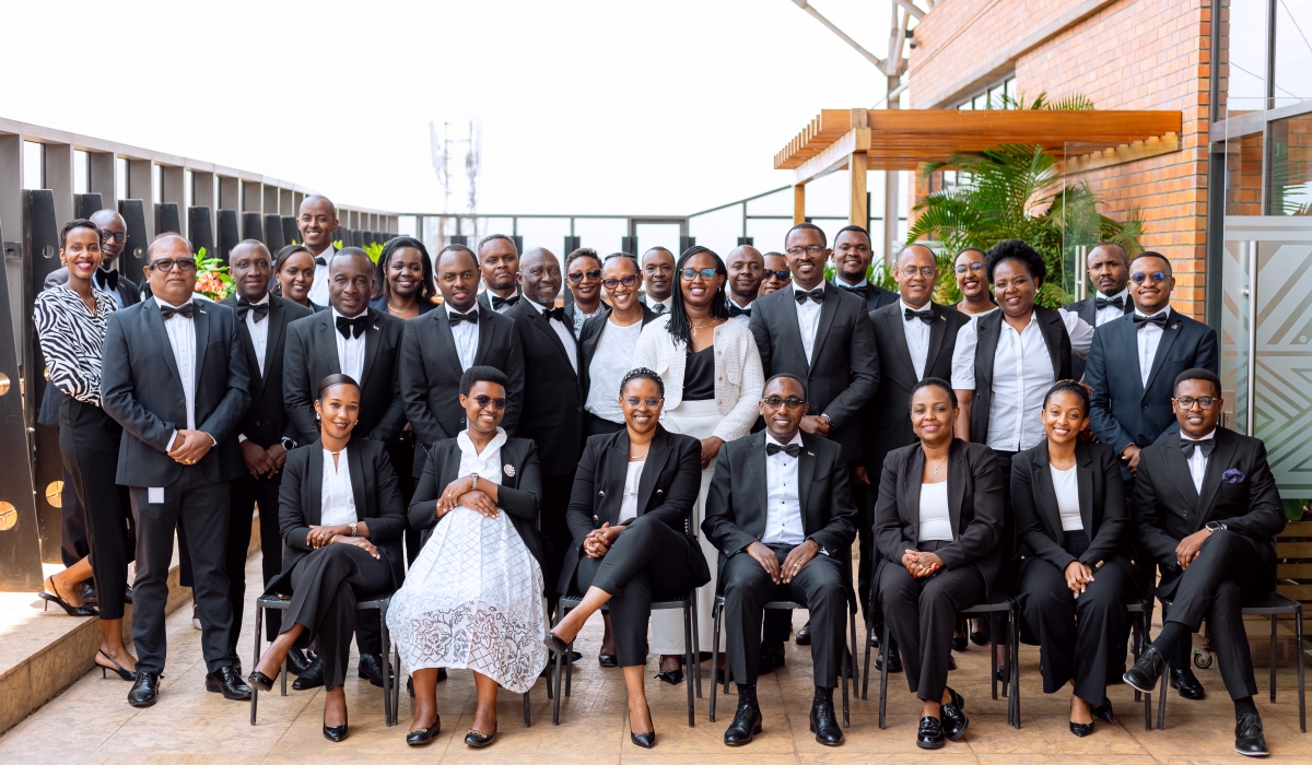 I&M Bank Rwanda officials and staff pose for a group photo.