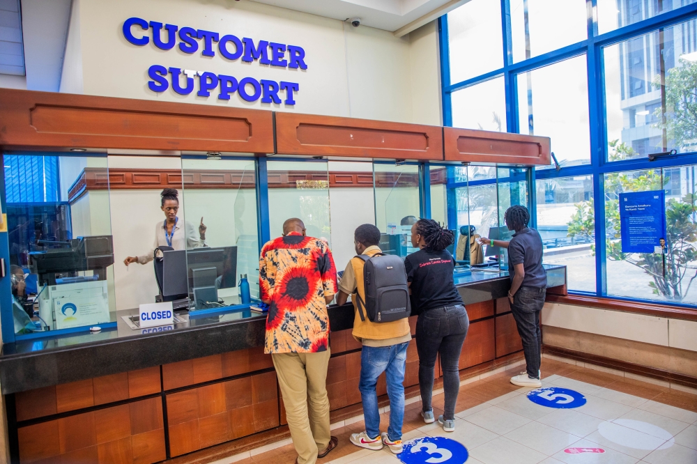 Bank of Kigali customers meet customer support desk staff at the main bank in Kigali. Photo by Craish Bahizi