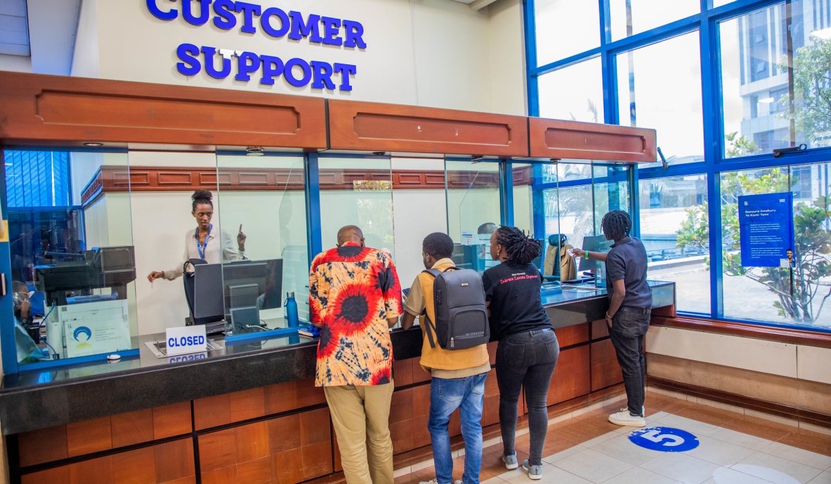 Bank of Kigali customers meet customer support desk staff at the main bank in Kigali. Photo by Craish Bahizi