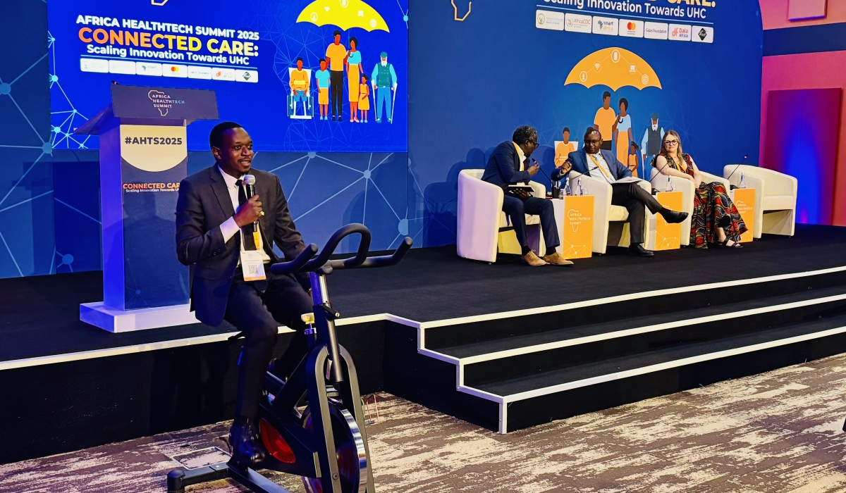 Rwanda NCD Alliance Executive Director, Alphonse Mbarushimana, riding an exercise bicycle for demonstration in line with be healthy be mobile theme at the Africa Health Tech Summit in Kigali, on October 13, 2025 (Emmanuel Ntirenganya).