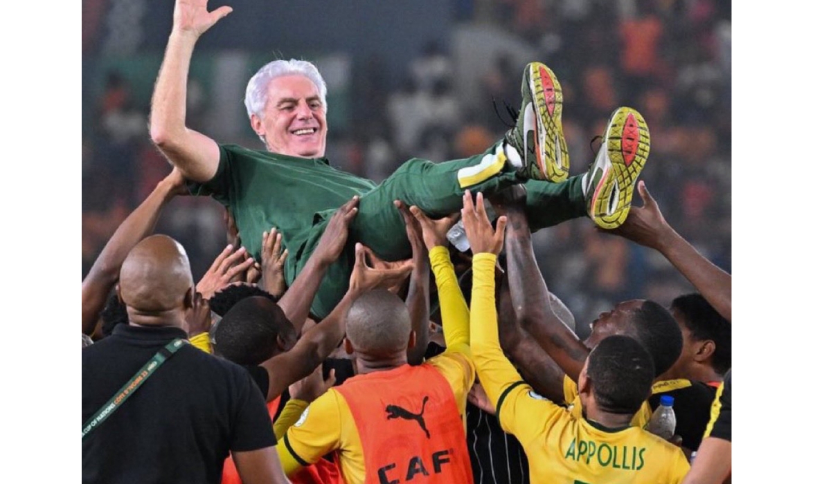 South Africa players lift head coach Hugo Broos to the skies after guiding them to the World Cup-courtesy