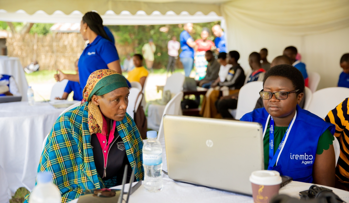 A resident is assisted by Irembo agent in Burera District.  The government is developing a new digital platform, Mbaza, designed to improve service delivery across local government institutions. File