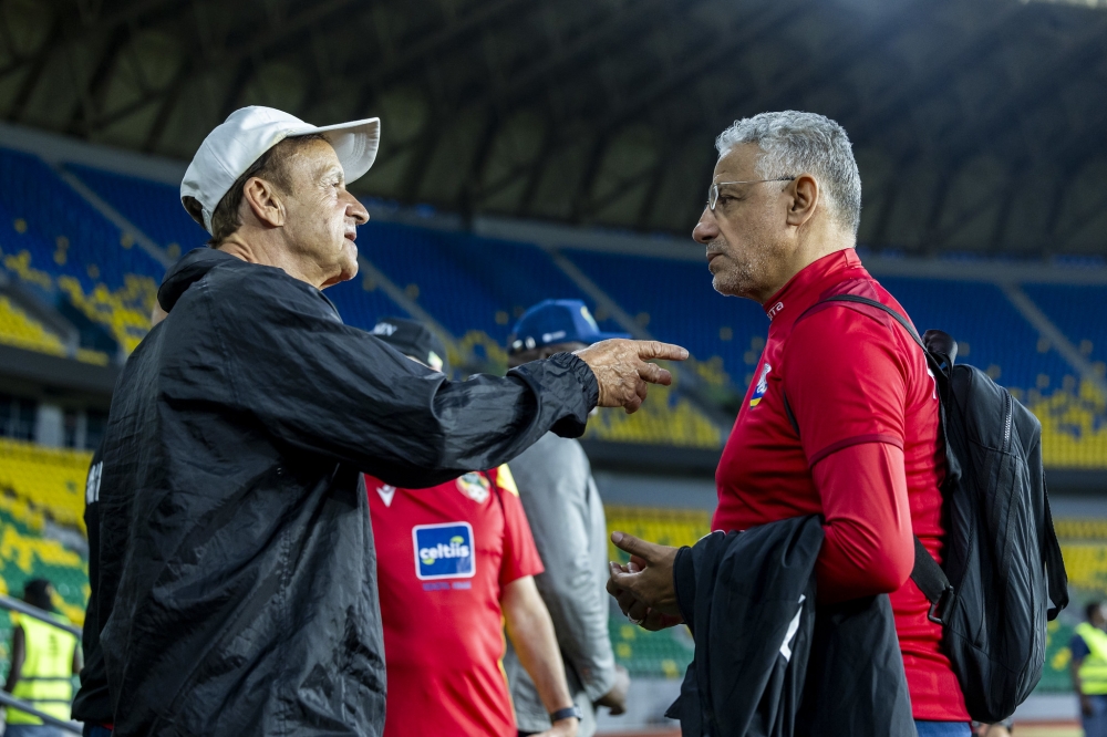 National team head coach Amrouche interacts with his assistant during a training session at Amahoro Stadium. Photo by Olivier Mugwiza