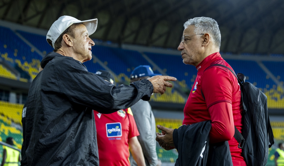 National team head coach Amrouche interacts with his assistant during a training session at Amahoro Stadium. Photo by Olivier Mugwiza