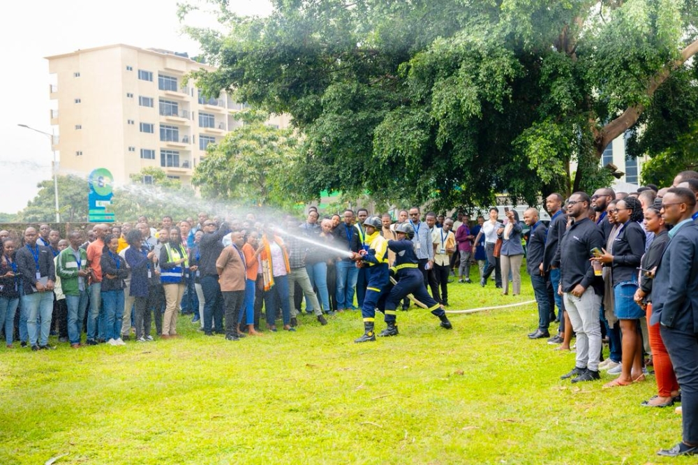 Officers demonstrate firefighting techniques during a drill aimed at practicing proper evacuation procedures and improving response coordination. Courtesy