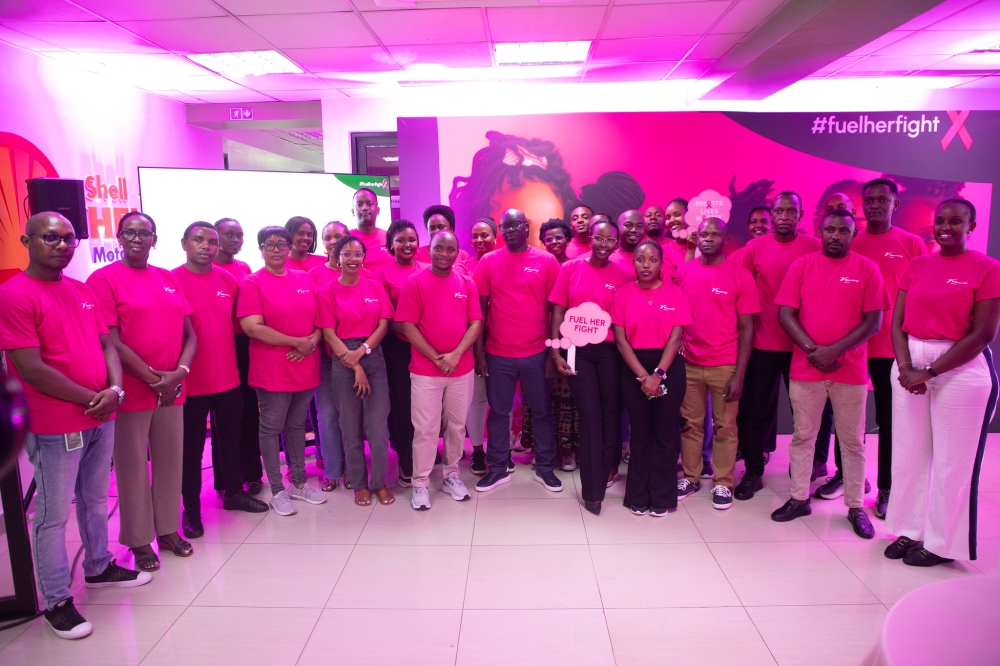 Vivo Energy Rwanda staff pose for a group photo at the launch of the Pink October campaign of joining the global efforts to fight breast cancer  on Friday, October 17. Photos by Craish BAHIZI