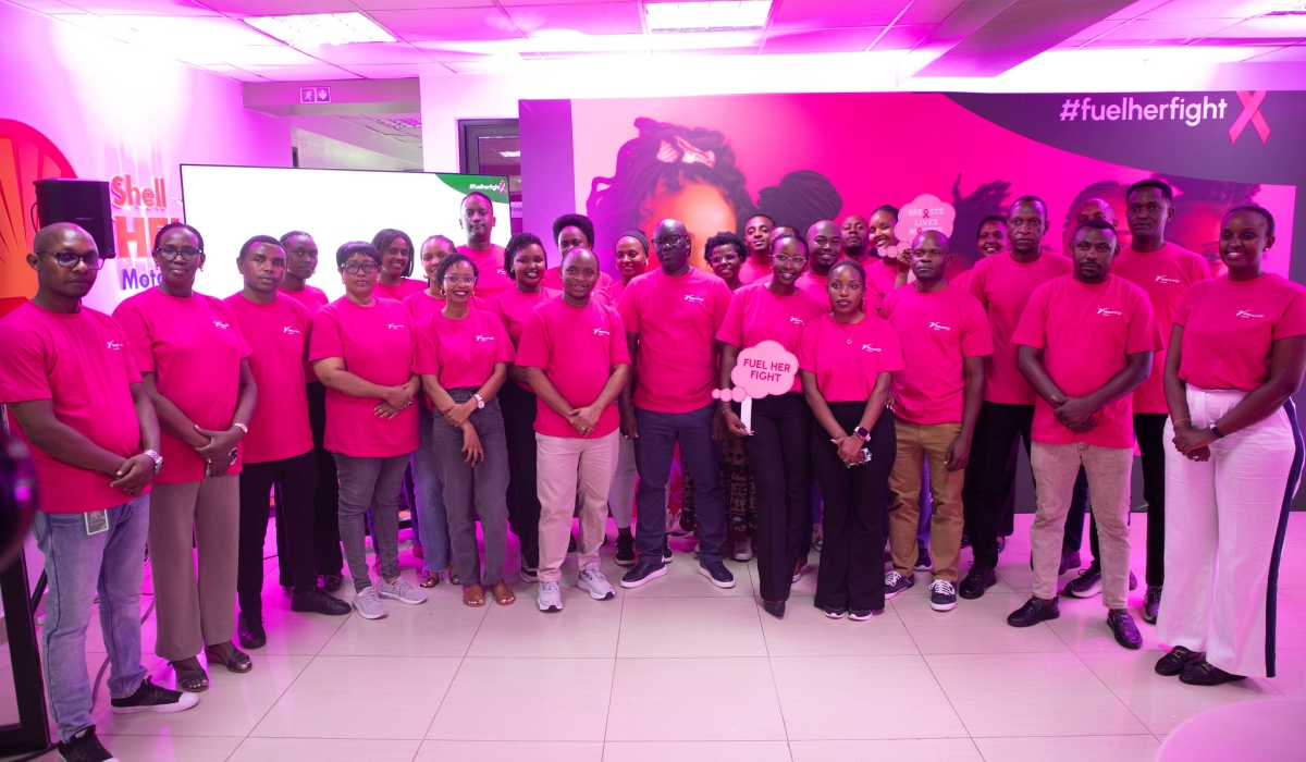 Vivo Energy Rwanda staff pose for a group photo at the launch of the Pink October campaign of joining the global efforts to fight breast cancer  on Friday, October 17. Photos by Craish BAHIZI